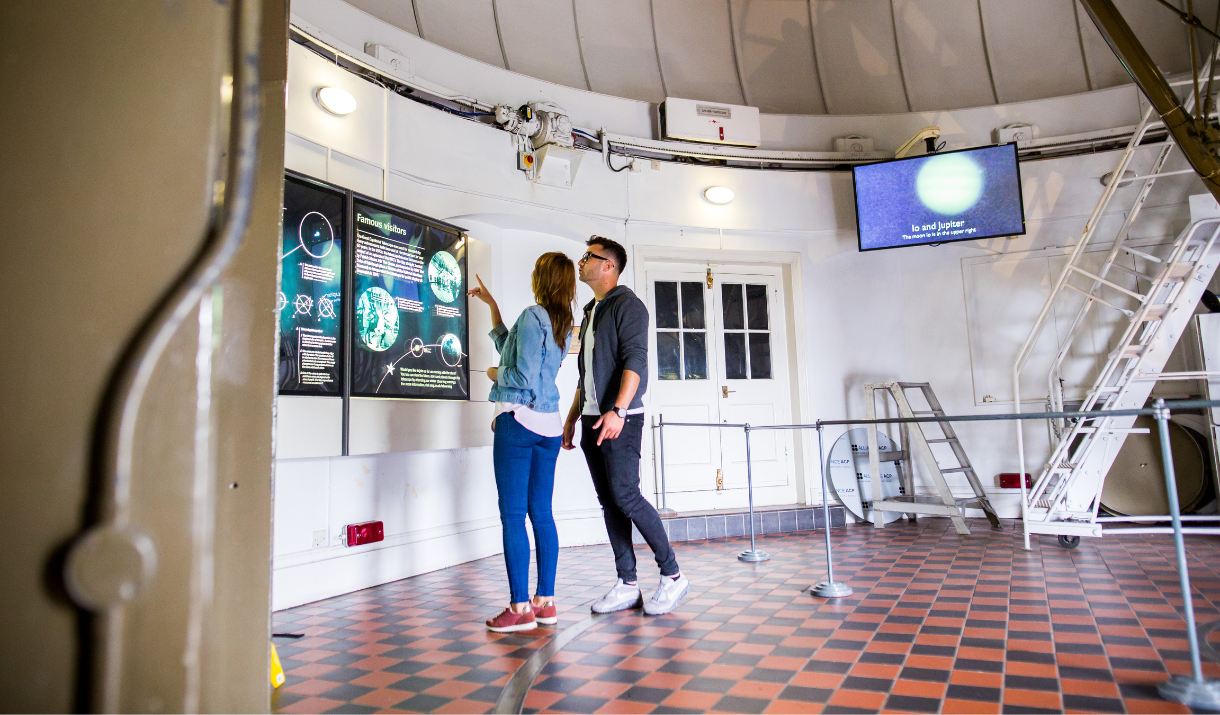 A couple visit the Great Equatorial Telescope at Royal Observatory, Greenwich